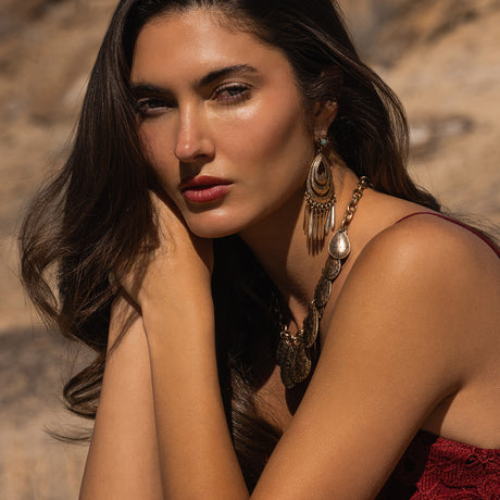 Woman with jewelry against a natural background